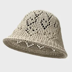 Beige crochet hollow bucket hat detail view, breathable mesh sun hat for summer daily wear.