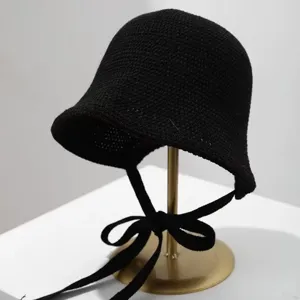 Black knitted bucket hat detail, Japanese style sun protection accessory, soft summer hat.
