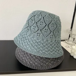 Detailed close-up of breathable mesh knitted bucket hat, showing hollow textured design.