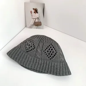 Dark grey hollow-knit bucket hat featuring diamond cable pattern for summer outdoor sun.