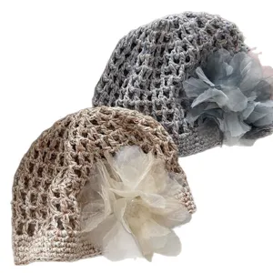 Stylish women's hollow out mesh crochet hat summer breathable beanie with elegant side flower decoration.