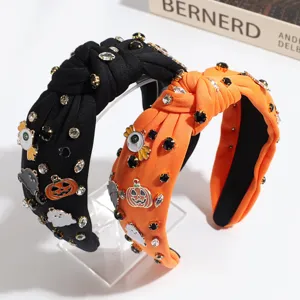 Halloween rhinestone knotted headband detail, featuring cute pumpkin and ghost charms.