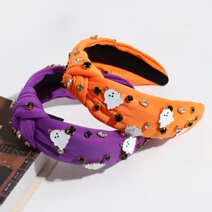 Halloween rhinestone ghost knotted headband detail showing vibrant orange and purple fabric.