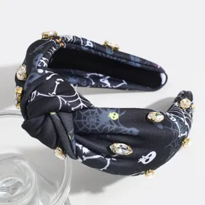 Black knotted rhinestone headband detail, featuring elegant spiderweb and skull print.