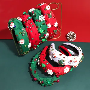 Detail view of Christmas knotted headbands with pearls, rhinestones and festive holiday accents.