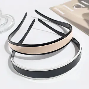 Close-up detail of contrast color hair hoops, glossy finish, minimalist style design.