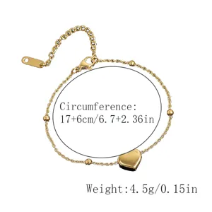 Gold heart pendant chain bracelet with extension, minimalist daily wrist jewelry piece.