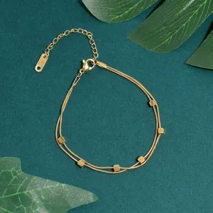Elegant double layer gold chain bracelet with small cube beads, detailed view for women jewelry.