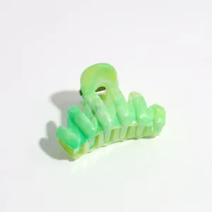 4cm small marbled hair claw clip detail view, featuring green aesthetic for half-up hair.