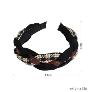 Stylish braided fabric headband with houndstooth and velvet mix, elegant winter hair accessory.