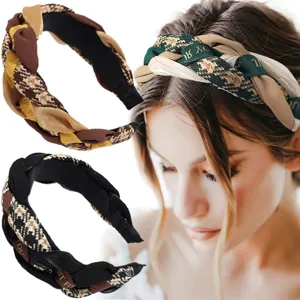 Detailed view of fashionable braided fabric hair hoop, stylish winter velvet hair band.