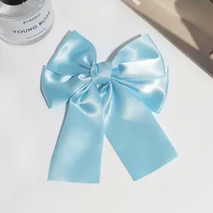 Light blue satin bow hair clip, elegant ribbon duckbill clip for daily stylish wear.
