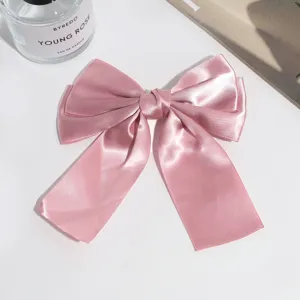 Satin ribbon bow hair clip detail, elegant pink duckbill clip for women daily vintage hair styling.