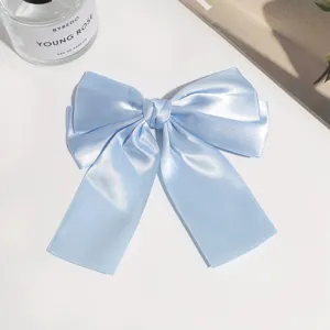 Light blue satin bow hair clip, elegant ribbon hair accessory with duckbill clip for daily styling.