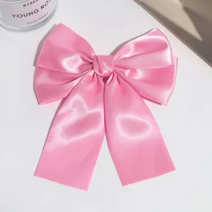 Pink satin bow hair clip for women, elegant ribbon hair accessory, cute daily barrette.