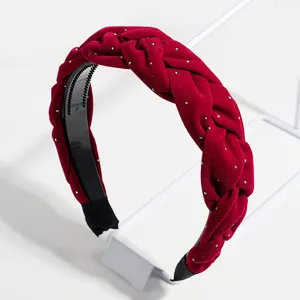 Red velvet braided headband with silver studs, chic hair hoop detail for women winter style.