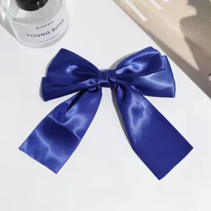 Blue satin bow hair clip, elegant vintage hair accessory with duckbill clip for women daily.