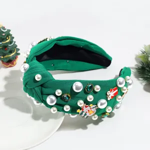 Grüner, geknoteter Weihnachts-Haarreif mit Perlen, Strass und festlichen Anhängern.