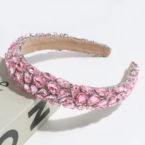Exquisite baroque pink crystal rhinestone headband detail view, sparkling bridal hair accessory.