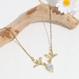 Elegant gold deer antler rhinestone clavicle chain necklace with a sparkling crystal pendant.