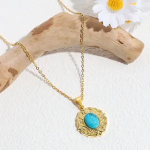Vintage gold turquoise pendant necklace detail, elegant oval gemstone clavicle chain jewelry.