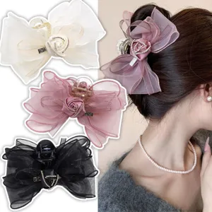 Detailed view of the Korean elegant mesh flower hair claw featuring sparkling rhinestones.