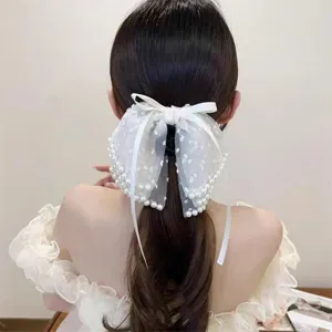 Detail view of Korean elegant mesh pearl hair claw clip, sparkly back head accessory.