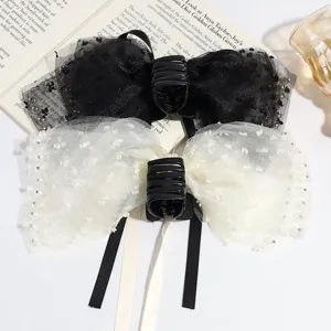 Elegant mesh bow hair claw clip with sparkling rhinestones, exquisite detail view of hair accessory.