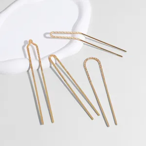 Gold U-shaped hair pins, elegant metallic hair forks set for buns and updos, fashion hair accessories.
