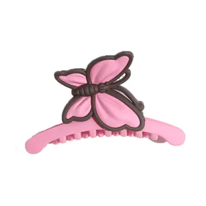 Graziosa molletta per capelli a farfalla rosa opaca, artiglio elegante per styling quotidiano.