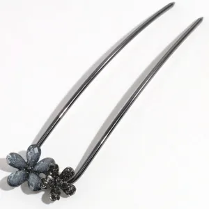 Close-up view of the elegant crystal flower U-shaped hair fork detail for styling.