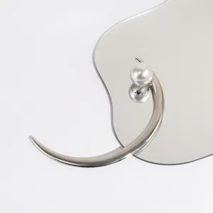 Elegant U-shaped hair pin detail showcasing refined pearl and metallic design for daily styling.