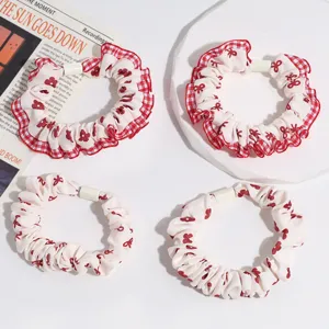 Sweet red plaid ruffle scrunchies with bow print, stylish hair ties for women ponytail.