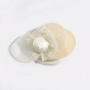 Elegant mesh fascinator detail, showcasing a satin rose flower and delicate pearl accents.