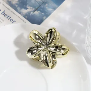 Gouden metalen bloem haarhaak clip, stijlvolle minimalistische haaraccessoire trendy.