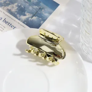 Gouden metalen haarclip met chique geometrisch wolken ontwerp voor stijlvolle kapsels.