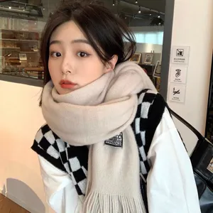 Cozy thick knit winter scarf detail view, soft warm casual fashion neck wrap for women.