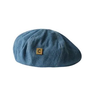 Classic blue denim beret hat with white stitching and metal C logo stylish painter cap for women