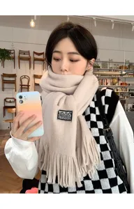 Cozy beige knit scarf for women, trendy winter warm long tassel neckerchief style.