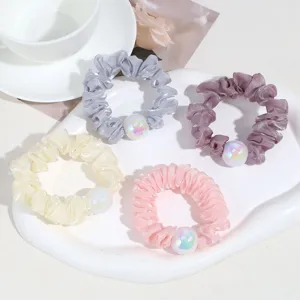 Élégants chouchous de cheveux élastiques avec perle irisée pour queue de cheval.