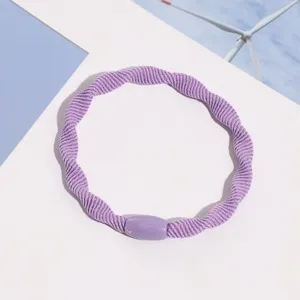 Purple braided hair tie close-up detail, elastic hair band accessory for daily wear and styling.