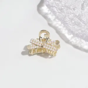 Elegant gold alloy small hair claw clip with faux pearls for women half-tied hair accessories.