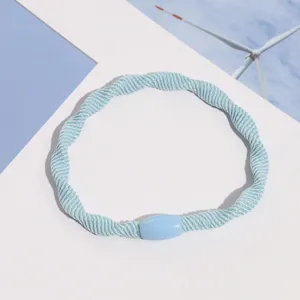 Light blue woven hair tie elastic hair band simple daily hair accessory for women.