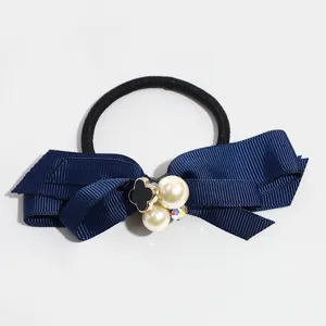 Korean style navy blue bow hair rope with faux pearl and black clover charm for women daily wear.