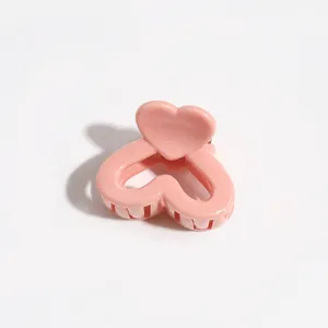 Pink heart hair claw clip detail, sweet candy color cute side hair accessory for bangs.