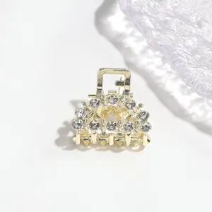 Detailed view of gold rhinestone small hair claw clip sparkling crystal fringe hairpin accessory