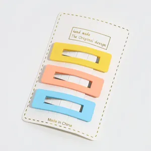 Detailed view of candy color rectangular hair clips set on a card, simple and fresh design.