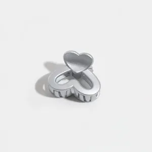 Silver heart hair claw clip, cute mini hair accessory for bangs and styling. Detail view.