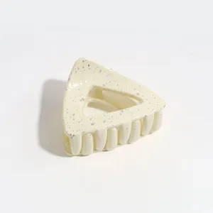 Triangle hair claw clip, Morandi beige color with silver glitter spots for women daily use.