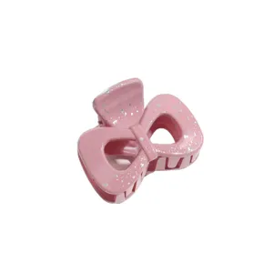 Pink bow hair claw clip with silver speckles, stylish hair accessories for women and girls.